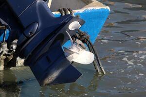 The propeller of a motor boat at the pier in the seaport. photo