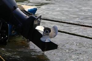 The propeller of a motor boat at the pier in the seaport. photo