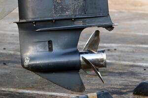 The propeller of a motor boat at the pier in the seaport. photo