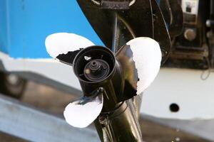 The propeller of a motor boat at the pier in the seaport. photo