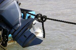 The propeller of a motor boat at the pier in the seaport. photo