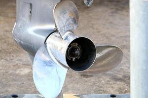 The propeller of a motor boat at the pier in the seaport. photo