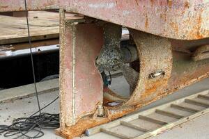 The propeller of a motor boat at the pier in the seaport. photo