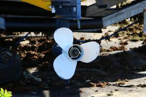 The propeller of a motor boat at the pier in the seaport. photo