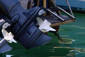 The propeller of a motor boat at the pier in the seaport. photo