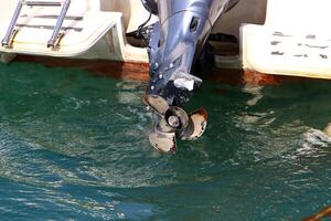 The propeller of a motor boat at the pier in the seaport. photo