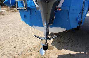 The propeller of a motor boat at the pier in the seaport. photo