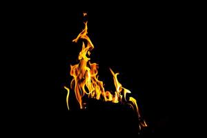 Fire flame texture. Burning material backdrop. Burn effect pattern. Blaze and torch wallpaper. Heat and haze backdrop. photo