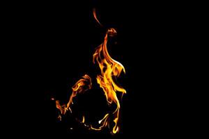 Fire flame texture. Burning material backdrop. Burn effect pattern. Blaze and torch wallpaper. Heat and haze backdrop. photo