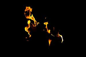 Fire flame texture. Burning material backdrop. Burn effect pattern. Blaze and torch wallpaper. Heat and haze backdrop. photo