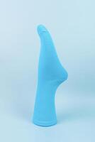 Blue cotton volumetric sock on blue background. advertising, logo, branding. photo