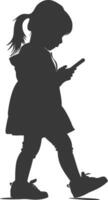 silhouette little girl walking while playing on smartphone black color only vector