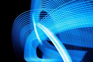 Colorful effect of neon lights glow and flash. Background with flying design elements. Blue background. photo