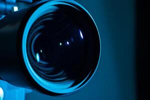 Close-up of a digital camera lens with dark light. Copy space for text. photo