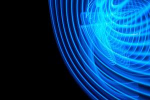 Neon lights glow and flash. Background with flying design elements. Blue background. photo
