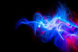 Futuristic light wave of energy with elegant glowing lines. Abstract technology background. photo