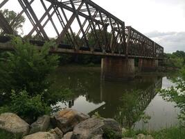 Manhattan Rail Bridge with River Reflection in Manhattan, Kansas photo