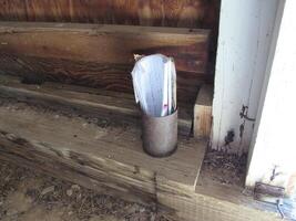 Rolled Up Paper in Tin Can in Corner of Abandoned Miner's Cabin photo