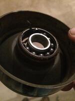 Broken Pulley For Car Belt, Missing Ball Bearings photo