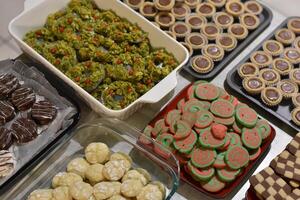 Assorted Real Homemade Christmas Cookies Sorted on Table photo