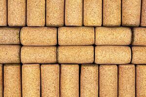 Background from textured wine corks, top view. place for text photo