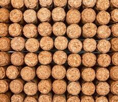 Background from textured wine corks, top view. place for text photo