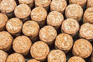 Background from textured wine corks, top view. place for text photo