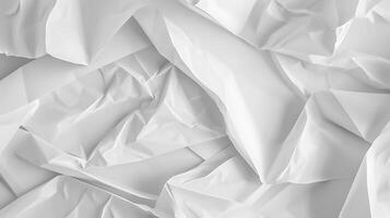 Abstract folded and crumpled white paper texture photo