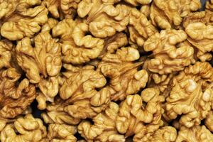 Walnuts background. Kernels walnuts. Top view. Vegetarian or healthy food photo
