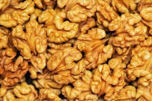 Walnuts background. Kernels walnuts. Top view. Vegetarian or healthy food photo