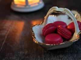 Macaroons and lantern moody food background. High quality photo