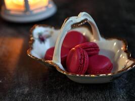 Macaroons and lantern moody food background. High quality photo