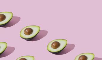 Trendy fruit pattern made of avocado on light pastel pink background with copy space. Minimal layout. Nature summer concept. Avocado aesthetic. photo