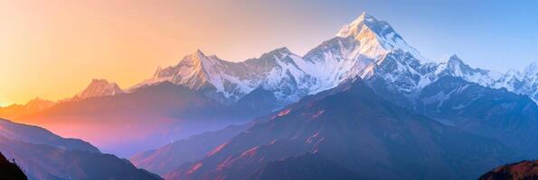 Sunrise brings a fiery crimson palette to mountains. photo