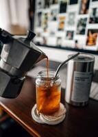 Make iced coffee from a moka pot and pour it into a glass. photo