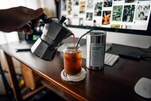 Make iced coffee from a moka pot and pour it into a glass. photo