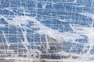 texture and full-frame background of several layers of transparent adhesive tape, quick cheap fix of broken window of the car photo