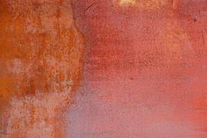 rusty red painted flat sheet metal surface full-frame background and texture photo