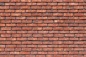 a close up of a red brick wall - full-frame background and texture photo