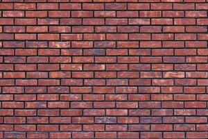 a close up of a red brick wall - full-frame background and texture photo