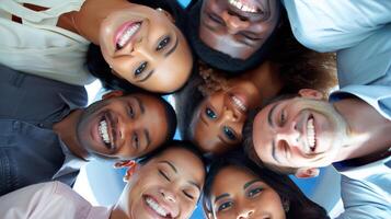 Happy business people with their heads together representing concept of friendship and teamwork photo