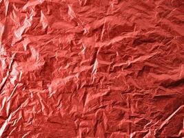 Abstract background made of Living Coral 2019 color. Festive backdrop for holidays and parties. Wrapping paper in Living Coral colour. Top view or flat lay. Copy sace for text photo