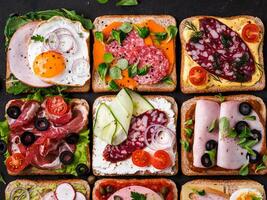 open sandwiches with different meat, top view photo