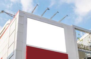 Mock up white horizontal large LED display billboard on entrance office building. Clipping path for mockup photo