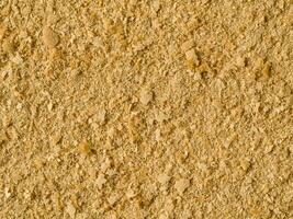 Nutritional yeast background. Nutritional inactive yeast top view. Copy space. Nutritional yeast is vegetarian superfood with cheese flavor, for healthy diet photo