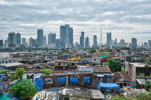 View of Mumbai skyline over slums in Bandra suburb photo