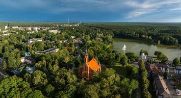 Aerial panoramic view of Lithuanian resort Druskininkai. Druskininkai in autumn colours, drone picture of multi coloured trees in most beautiful city of Druskininkai in Lithuania photo