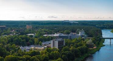 Aerial panoramic view of Lithuanian resort Druskininkai. Druskininkai in autumn colours, drone picture of multi coloured trees in most beautiful city of Druskininkai in Lithuania photo