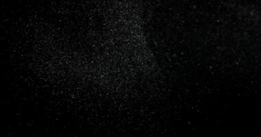 Cinematic dust particles on black screen overlay. Filmed with RED camera in slow motion. Abstract shapes background. video