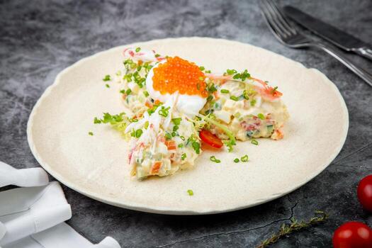 salad with mozzarella, caviar and green onions on a white plate, side view photo